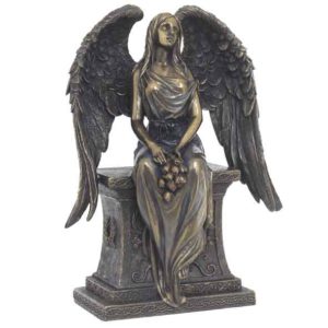 Bronze Angel With Roses Sitting On A Tombstone Statue